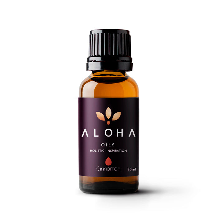 A 20ml amber glass bottle of Aloha Oils Cinnamon essential oil with a sleek black cap and a modern purple label featuring the Aloha Oils logo and the tagline 'Holistic Inspiration.'