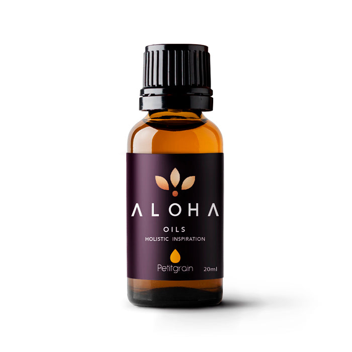 A 20ml amber glass bottle of Aloha Oils Petitgrain essential oil with a sleek black cap and a modern purple label featuring the Aloha Oils logo and the tagline 'Holistic Inspiration.'